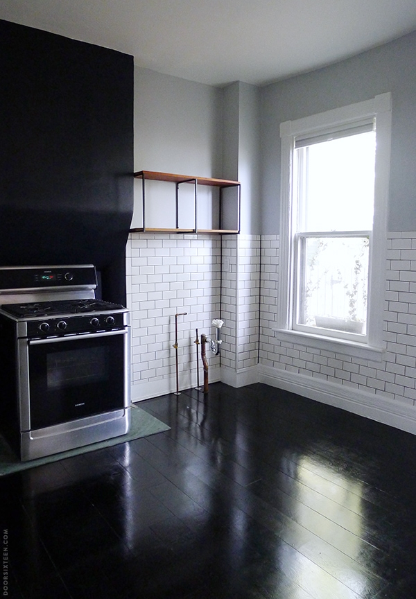 dark painted plywood floors