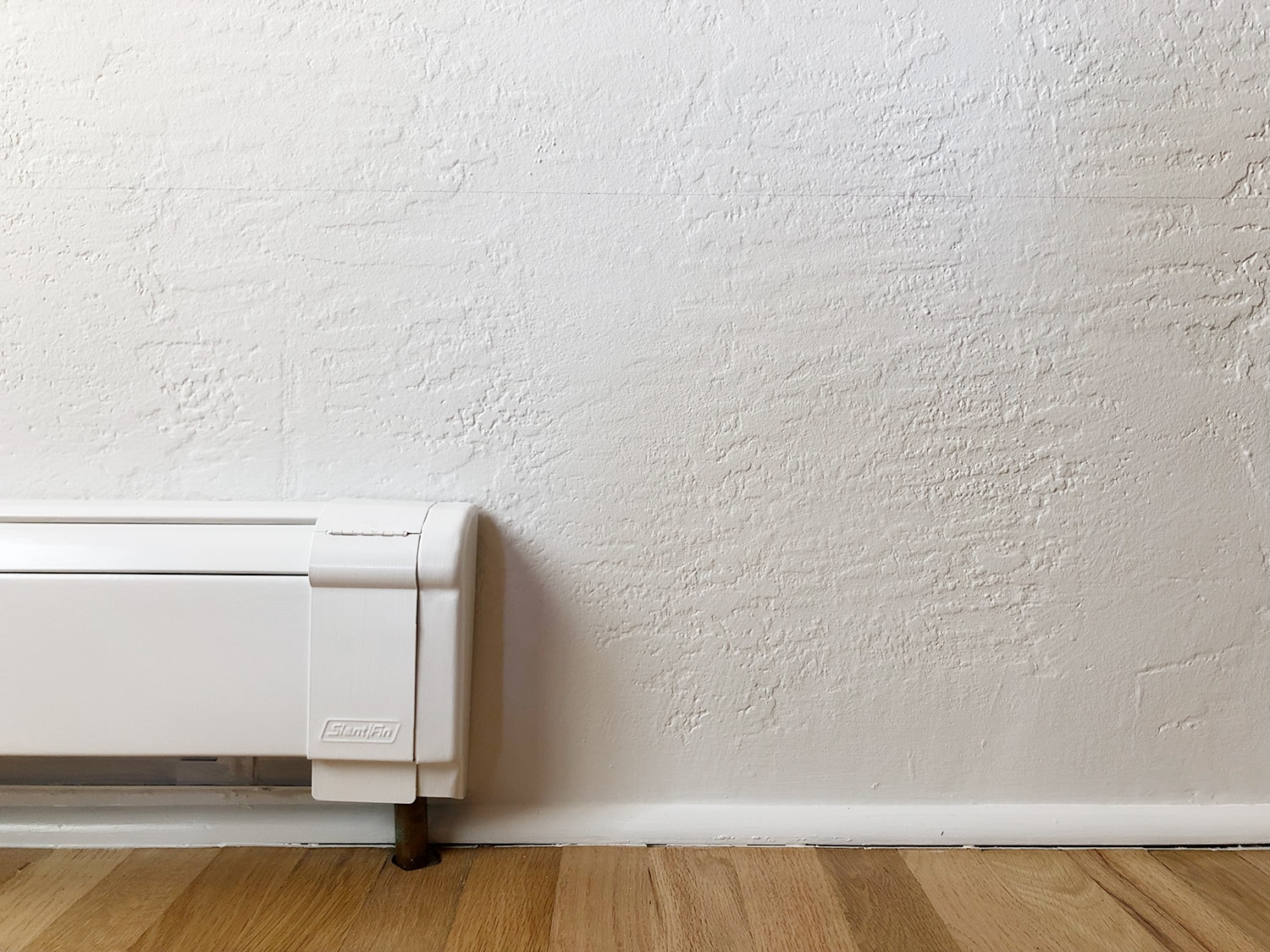 white baseboard radiator